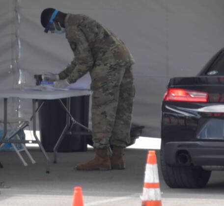 March 23, 2020, Miami Gardens, Florida, United States Of America: MIAMI GARDENS, FL - MARCH 22: FIRST RESPONDERS ONLY TESTING DAY - Instead of setting up for the Miami Open tennis tournament, the Florida National Guard (many without face masks due to shortage) was running a drive-through testing site off the Florida Turnpike at the Hard Rock Stadium in Miami Gardens where people can go for a COVID-19 Test Without Getting out of their Cars. As Miami-Dade Countys number of COVID-19 cases rise to 169, the site will open at 9 a.m. Monday in the east parking lot of the Hard Rock Stadium, 347 Don Shula Drive. The testing is free and the site will be open from 9 a.m. to 5 p.m. on a daily basis, said Juan Diasgranados, a spokesperson for the testing site. The test site will be run and was created by several local, state and national agencies wh - ZUMAs214 20200323_zaa_s214_011 Copyright: xSMGx