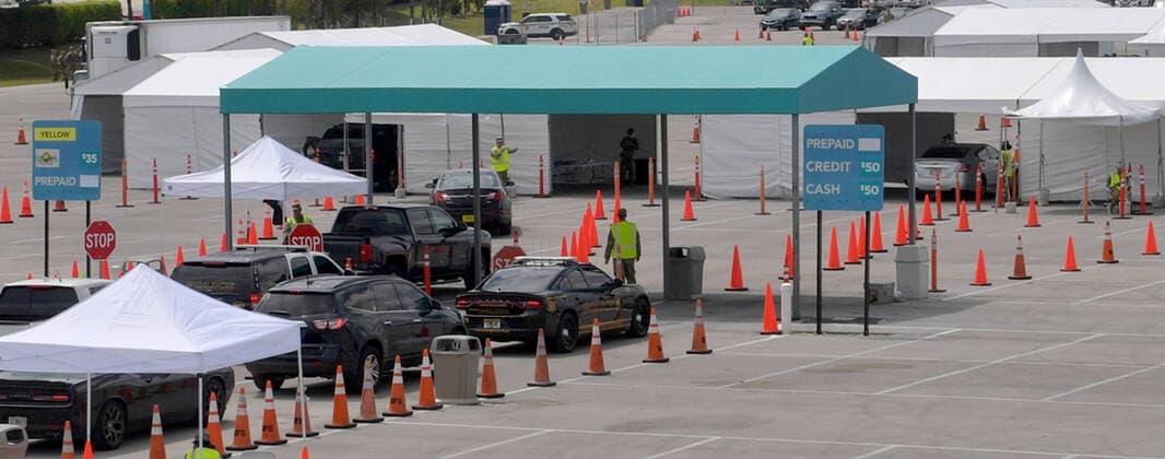 March 23, 2020, Miami Gardens, Florida, United States Of America: MIAMI GARDENS, FL - MARCH 22: FIRST RESPONDERS ONLY TESTING DAY - Instead of setting up for the Miami Open tennis tournament, the Florida National Guard (many without face masks due to shortage) was running a drive-through testing site off the Florida Turnpike at the Hard Rock Stadium in Miami Gardens where people can go for a COVID-19 Test Without Getting out of their Cars. As Miami-Dade Countys number of COVID-19 cases rise to 169, the site will open at 9 a.m. Monday in the east parking lot of the Hard Rock Stadium, 347 Don Shula Drive. The testing is free and the site will be open from 9 a.m. to 5 p.m. on a daily basis, said Juan Diasgranados, a spokesperson for the testing site. The test site will be run and was created by several local, state and national agencies wh - ZUMAs214 20200323_zaa_s214_015 Copyright: xSMGx