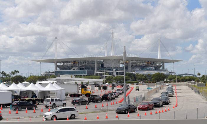 MIAMI GARDENS, FL - MARCH 22: FIRST RESPONDERS ONLY TESTING DAY - Instead of setting up for the Miami Open tennis tournament, the Florida National Guard (many without face masks due to shortage) was running a drive-through testing site off the Florida Turnpike at the Hard Rock Stadium in Miami Gardens where people can go for a COVID-19 Test Without Getting out of their Cars. As Miami-Dade CountyÃ¢â‚¬â ¢s number of COVID-19 cases rise to 169, the site will open at 9 a.m. Monday in the east parking lot of the Hard Rock Stadium, 347 Don Shula Drive. The testing is free and the site will be open from 9 a.m. to 5 p.m. on a daily basis, said Juan Diasgranados, a spokesperson for the testing site. The test site will be run and was created by several local, state and national agencies which include FEMA, the CDC, Florida Department of Health, Flo - ZUMAs214 20200323_zba_s214_018 Copyright: xSMGx
