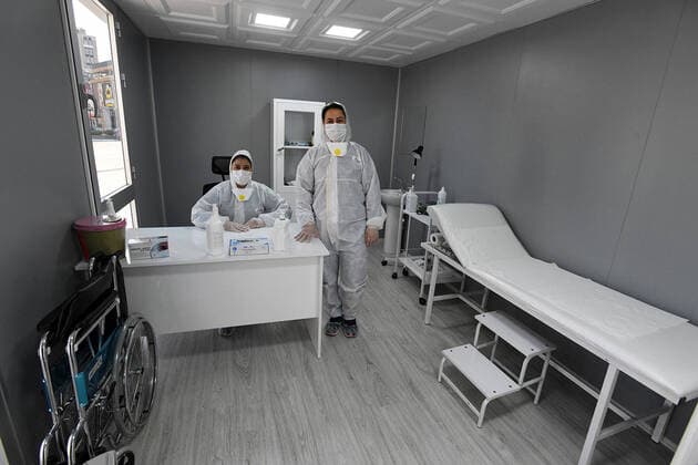 (200323) -- ANKARA, March 23, 2020 -- Medical workers wait at a temporary clinic for COVID-19 testing in downtown Ankara, Turkey, on March 22, 2020. The death toll from COVID-19 in Turkey rose to 30 on Sunday, Turkish Health Minister Fahrettin Koca said. The minister tweeted that nine people lost their lives on Sunday, and 289 new patients were diagnosed, bringing the total number of confirmed cases to 1,236. (Photo by Mustafa Kaya Xinhua) TURKEY-ANKARA-COVID-19-TEMPORARY CLINIC zhengsiyuan 