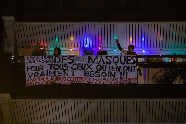 (200323) -- PARIS, March 23, 2020 (Xinhua) -- Residents applaud to pay tribute to medical staff in Clichy, France, March 22, 2020. The activity can be seen in several cities in France. The number of confirmed coronavirus cases in France has risen by 1,559 within a day to 16,018, while the death toll increased by 112 to 674 in total, Health General Director Jerome Salomon said on Sunday. (Photo by Aurelien Morissard Xinhua) FRANCE-PARIS-COVID-19-TRIBUTE TO MEDICAL STAFF-APPLAUSE 