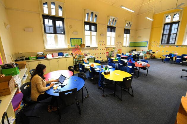 COVID19 VIC SCHOOL CLOSURES, A teacher is seen in an empty class room at a primary school in Melbourne s inner north, Monday, March 23, 2020. Victorian Premier Daniel Andrews has brought forward school holidays as a measure to slow the rapid spreading Covid-19 virus throughout the state. ( NO ARCHIVING, EDITORIAL USE ONLY, NO USE IN BOOKS WITHOUT CONSENT MELBOURNE VIC AUSTRALIA  Copyright: xJAMESxROSSx 20200323001458878919