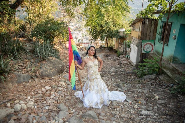 March 22, 2020, Jalcomulco, Veracruz, Mo xico: Members of the LGBTTI court of the Jalcomulco carnival carry out an awareness and prevention campaign of COVID-19. The royal court is made up of a queen and princesses who dance and celebrate during the carnival through the streets of the town. This year, the party and carnival have been canceled to prevent some kind of contagion among the population, however, the court does not miss the opportunity to send a message to the residents to wash their hands and avoid leaving home. Jalcomulco MÃ xico - ZUMAqp1_ 20200322_zip_qp1_026 Copyright: xHectorxAdolfoxQuintanarxPerezx
