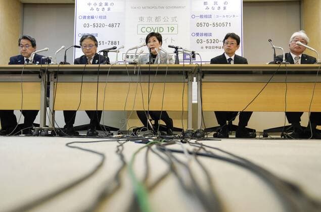 Tokyo Gov. Koike Tokyo Gov. Yuriko Koike (C) speaks at a press conference in Tokyo on March 23, 2020, after attending a meeting on stemming the spread of the new coronavirus. She said requests to the public for restraint on big events will be extended through April 12 to prevent explosive infections of the virus. 