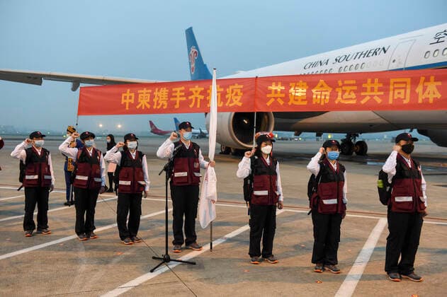 (200323) -- NANNING, March 23, 2020 -- Members of the Chinese medical team make a vow before leaving for Cambodia in Nanning, south China s Guangxi Zhuang Autonomous Region, March 23, 2020. The Chinese government has sent a team of medical experts to Cambodia to help the country fight the COVID-19 pandemic, Foreign Ministry spokesperson Geng Shuang announced Monday. ) CHINA-GUANGXI-NANNING-COVID-19-CAMBODIA-EXPERTS-DEPARTURE (CN) CaoxYiming 