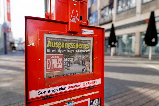 The deserted Schildergasse with headline of the Cologne tabloid Kölner Express on a possible curfew during the Corona crisis Cologne, 22 03 2020 Foto:xC.xHardtx xFuturexImage