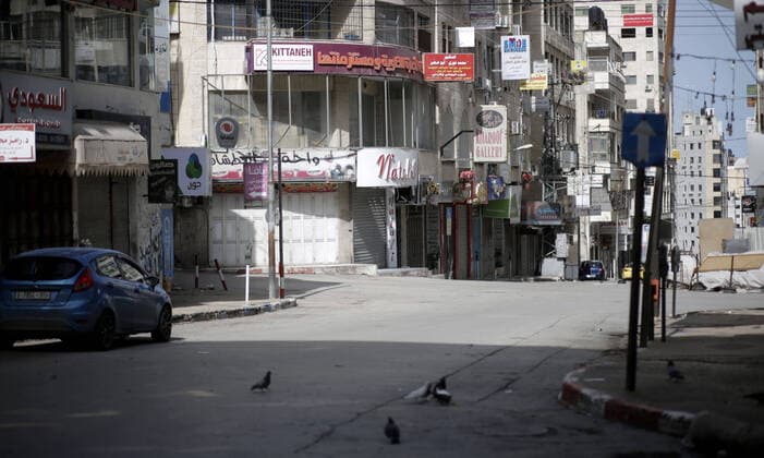 March 23, 2020, Nablus, West Bank, Palestinian Territory: A view of closed stores as a preventive measure against the coronavirus during of a mandatory quarantine that was announced by the Palestinian Authority as part of measures against the COVID-19 coronavirus pandemic, in the West Bank city of Nablus on March 23, 2020. The Palestinian Health Ministry today reported its first two cases of the novel coronavirus in the Gaza Strip. undertook serious measures to preempt the arrival of the virus to the strip. Up until its decision to seal off its sides of the Rafah crossing with Egypt and the Erez checkpoint with Israel, hundreds of Palestinians who entered the strip were immediately quarantined to ensure they had no symptoms of the disease Nablus Palestinian Territory - ZUMAap3_ 20200323_zaf_ap3_052 Copyright: xShadixJarar Ahx