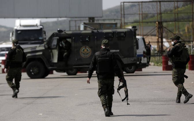 March 23, 2020, Nablus, West Bank, Palestinian Territory: Palestinian policemen stand at the streets during of a mandatory quarantine that was announced by the Palestinian Authority as part of measures against the COVID-19 coronavirus pandemic, in the West Bank city of Nablus on March 23, 2020. The Palestinian Health Ministry today reported its first two cases of the novel coronavirus in the Gaza Strip. undertook serious measures to preempt the arrival of the virus to the strip. Up until its decision to seal off its sides of the Rafah crossing with Egypt and the Erez checkpoint with Israel, hundreds of Palestinians who entered the strip were immediately quarantined to ensure they had no symptoms of the disease Nablus Palestinian Territory - ZUMAap3_ 20200323_zaf_ap3_069 Copyright: xShadixJarar Ahx