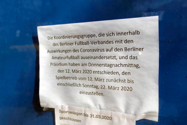 23 03 2020, Berlin, Germany Corona crisis Photo Notice on a football field in Berlin Friedrichshain Sports facility closed due to corona epidemic