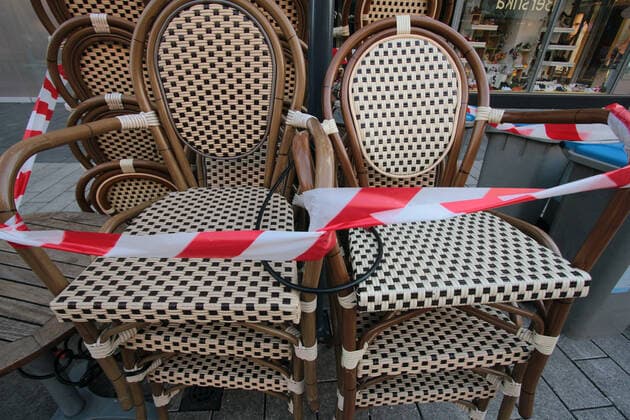 Chairs of a closed café in the city centre of Mannheim, Baden Württemberg, Germany