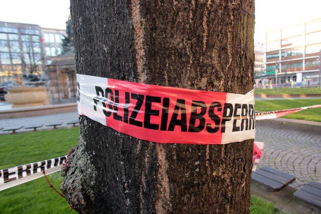 Due to the official order to stop public life as far as possible, an assembly ban was issued in public places For this reason, the Paradeplatz in downtown Mannheim was closed to persons by a barrier tape with the inscription Polizeiabsperrung, Baden Württemberg, Germany