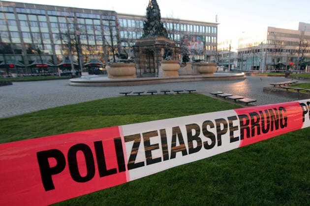 Due to the official order to stop public life as far as possible, an assembly ban was issued in public places For this reason, the Paradeplatz in downtown Mannheim was closed to persons by a barrier tape with the inscription Polizeiabsperrung, Baden Württemberg, Germany