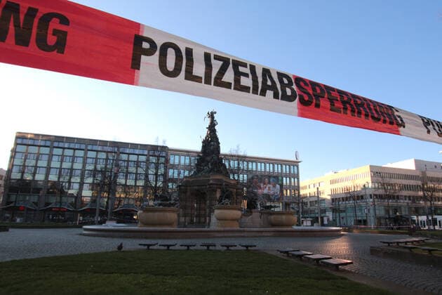Due to the official order to stop public life as far as possible, an assembly ban was issued in public places For this reason, the Paradeplatz in downtown Mannheim was closed to persons by a barrier tape with the inscription Polizeiabsperrung, Baden Württemberg, Germany