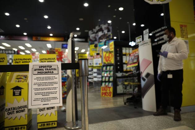(200323) -- CANBERRA, March 23, 2020 -- Photo taken on March 23, 2020 shows a note to limit customers while shopping at a store in Canberra, Australia. Non-essential venues across Australia have been ordered to close from midday on Monday in order to slow the spread of COVID-19. Prime Minister Scott Morrison on Sunday night announced an escalation of social distancing measures, including the mandatory closure of cinemas, pubs, entertainment venues, indoor sporting venues and so on. Restaurants and cafes will remain open but will only be allowed to offer takeaway and or home delivery services. (Photo by Xinhua) AUSTRALIA-CANBERRA-COVID-19-SOCIAL DISTANCING MEASURES ChuxChen 