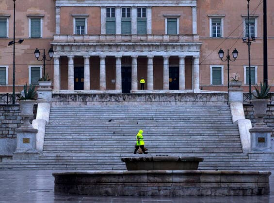 (200323) -- ATHENS, March 23, 2020 -- An employee of the Municipality of Athens is seen in Syntagma square in Athens, Greece, March 23, 2020. Greece proceeds to a 14-day nationwide lockdown effective from Monday in the context of confinement measures aimed to contain the further spread of the novel coronavirus, the government announced on Sunday. ) GREECE-ATHENS-COVID19-LOCKDOWN MariosxLolos 