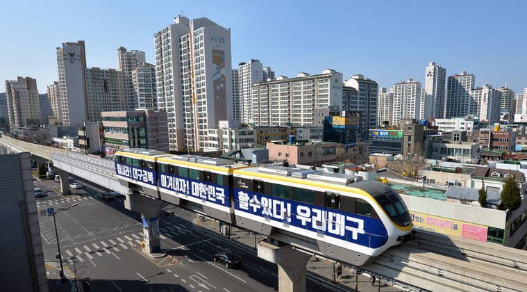 (200323) -- SEOUL, March 23, 2020 -- A metro train with inspiring slogans runs past the downtown area of Daegu, South Korea, March 23, 2020. South Korea reported 64 more cases of the COVID-19 compared to 24 hours ago as of midnight Monday local time, raising the total number of infections to 8,961. The newly confirmed cases fell below 100 for the second straight day, after recording 147 on Saturday. The caseload moved above or below 100 for the past week. (Newsis Handout via Xinhua) SOUTH KOREA-COVID-19 WangxJingqiang 