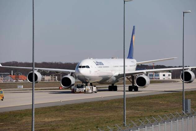 Germany Frankfurt 23 03 2020 Frankfurt Airport the northwest runway becomes a Lufthansa parking lot Aircraft is pulled to park and follows the vehicle to the parking lot Economy Frankfurt Airport runway becomes a parking lot