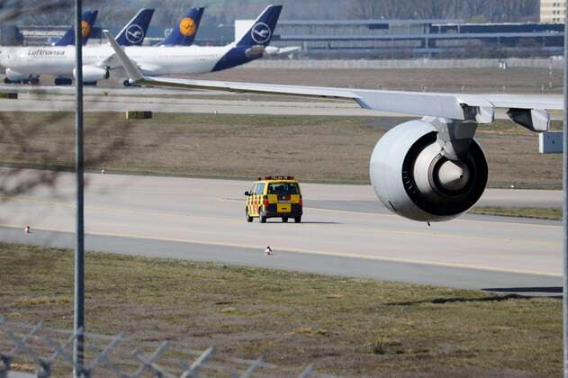Germany Frankfurt 23 03 2020 Frankfurt Airport the northwest runway becomes a Lufthansa parking lot Aircraft is pulled to park and follows the vehicle to the parking lot Economy Frankfurt Airport runway becomes a parking lot