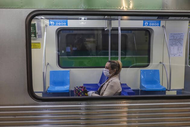 (200323) -- SAO PAULO, March 23, 2020 -- A woman wears a face mask inside a subway train in Sao Paulo, Brazil, March 22, 2020. Many countries in Latin America have imposed quarantines to stop the COVID-19 spread, as more and more confirmed cases were reported. In Brazil, one of the hardest-hit countries in the region, the number of cases rose to 1,128 on Saturday, with 18 deaths. In the 26 Brazilian states hit by the virus, Sao Paulo, the worst-hit one, has confirmed 459 cases and 15 deaths. As a result, authorities on March 21 ordered a quarantine and a halt to most economic activities for 15 days. Rahel Patrasso) BRAZIL-SAO PAULO-COVID-19 LaxHeer¡¤patelasuo 