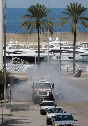(200323) -- BEIRUT, March 23, 2020 -- Photo taken on March 23, 2020 shows a vehicle sterilizing a street in Beirut, Lebanon. Lebanon s Health Ministry announced on Monday that the number of COVID-19 confirmed cases in the country has risen to 256, the National News Agency reported. Security forces were deployed all over Lebanon to control the movement of people after the tough measures announced by the Lebanese government a day earlier. (Photo by Bilal Jawich Xinhua) LEBANON-BEIRUT-COVID-19 LixLiangyong 