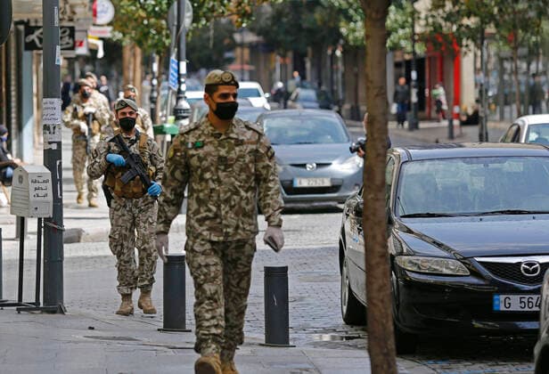 (200323) -- BEIRUT, March 23, 2020 -- Photo taken on March 23, 2020 shows members of the security forces patrol in Beirut, Lebanon. Lebanon s Health Ministry announced on Monday that the number of COVID-19 confirmed cases in the country has risen to 256, the National News Agency reported. Security forces were deployed all over Lebanon to control the movement of people after the tough measures announced by the Lebanese government a day earlier. (Photo by Bilal Jawich Xinhua) LEBANON-BEIRUT-COVID-19 LixLiangyong 