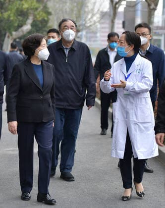 (200323) -- WUHAN, March 23, 2020 -- Chinese Vice Premier Sun Chunlan, also a member of the Political Bureau of the Communist Party of China Central Committee, visits a hospital in Wuhan, capital city of central China s Hubei Province, March 23, 2020. Leading a central government group to oversee the epidemic control work in Hubei, Sun visited two hospitals and a community health service center in Wuhan on Monday. Sun urged medical institutions to restore medical services for non-COVID-19 patients while continuing efforts against the coronavirus. ) CHINA-WUHAN-SUN CHUNLAN-COVID-19-MEDICAL INSTITUTIONS (CN) LixHe 