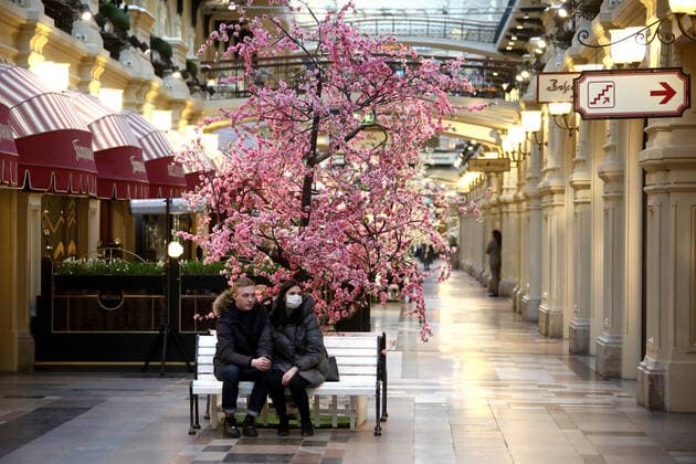 MOSCOW, RUSSIA - MARCH 23, 2020: People wearing face masks seen at the GUM department store during the COVID-19 coronavirus pandemic. Valery Sharifulin TASS  TS0D327E