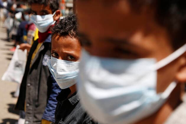 (200323) -- SANAA, March 23, 2020 -- Orphans wear masks they received as an aid against the coronavirus in an orphan center in Sanaa, Yemen, March 23, 2020. A local charity organization in Sanaa distributed on Monday health kits of masks and disinfectants to Yemeni orphan students as an aid to protect them against the coronavirus. (Photo by Mohammed Mohammed Xinhua) YEMEN-SANAA-CORONAVIRUS-HEALTH KIT-DISTRIBUTION NiexYunpeng 