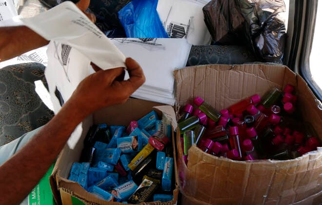 (200323) -- SANAA, March 23, 2020 -- A worker prepares health kits of masks and disinfectants to be distributed to orphan students in an orphan center in Sanaa, Yemen, March 23, 2020. A local charity organization in Sanaa distributed on Monday health kits of masks and disinfectants to Yemeni orphan students as an aid to protect them against the coronavirus. (Photo by Mohammed Mohammed Xinhua) YEMEN-SANAA-CORONAVIRUS-HEALTH KIT-DISTRIBUTION NiexYunpeng 