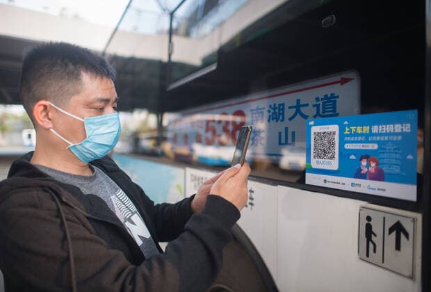 (200323) -- WUHAN, March 23, 2020 -- A staff tests the QR code for real-name registration at the bus terminal in Wuhan, central China s Hubei Province, March 23, 2020. Wuhan is making preparations for restoring the operation of public transportation. The public need to go through real-name registration for taking public transportation or taxis in Wuhan, capital of central China s Hubei Province, authorities said Sunday. ) CHINA-HUBEI-WUHAN-PUBLIC TRANSPORTATION SYSTEM-PREPARATION-OPERATION RESTORATION (CN) XiaoxYijiu 