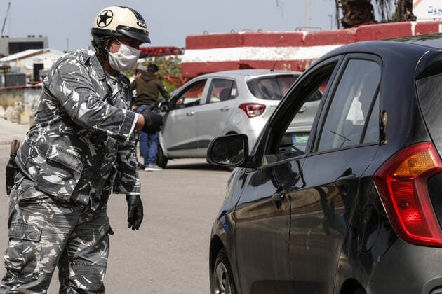 March 23, 2020, Beirut, Lebanon: Lebanese policeman wearing a mask as a means of protection against the coronavirus COVID-19. For most people, the new coronavirus causes only mild or moderate symptoms. For some it can cause more severe illness Beirut Lebanon - ZUMAews 20200323_mda_ap3_115 Copyright: xMarwanxTahtahx