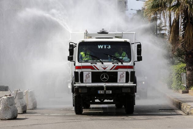 March 23, 2020, Beirut, Lebanon: A Lebanese car sprays antiseptics as a preventive measure amid fears of the spread of the coronavirus,. For most people, the new coronavirus causes only mild or moderate symptoms. For some it can cause more severe illness Beirut Lebanon - ZUMAews 20200323_mda_ap3_117 Copyright: xMarwanxTahtahx