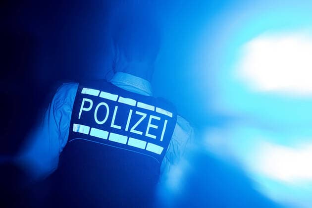 Symbol picture with a policeman and blue light Stuttgart Copyright: xMarcxGruberx