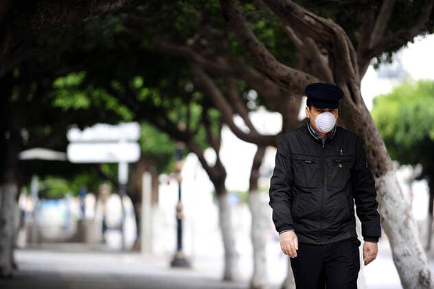 COVID-19 Algeria , Algiers , March 23, 2020 An Algerian man wears a mask in Algiers a street , Monday, March 23, 2020.Algeria reported a new death from COVID-19 .  Copyright: KADRIxMohamed