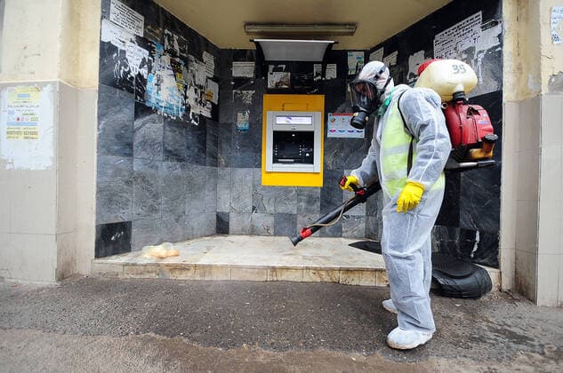 COVID-19 Algeria , Algiers , March 23, 2020 A man disinfects a street of Algiers, Monday, March 23, 2020.Algeria reported a new death from COVID-19 .  Copyright: KADRIxMohamed