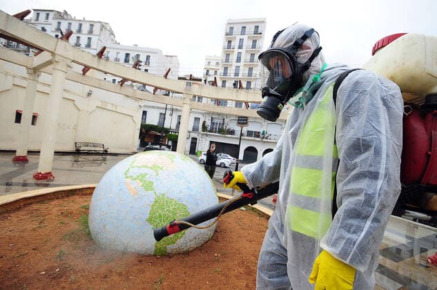 COVID-19 Algeria , Algiers , March 23, 2020 A man disinfects a street of Algiers, Monday, March 23, 2020.Algeria reported a new death from COVID-19 .  Copyright: KADRIxMohamed