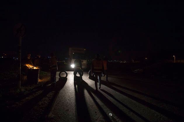 March 23, 2020, Battir, Bethlehem, West Bank: Palestinian Emergency Comittie members of the Western Countryside of Bethlehem while making a checkpoint to reduce the unnecessary movement in their effort to reduce the spread of COVID-19 in the area, which isn t under Palestinian security control according to Oslo accord between PLO & Israel. Battir, Bethlehem West Bank - ZUMAb133 20200323_zap_b133_005 Copyright: xMustafaxBaderx