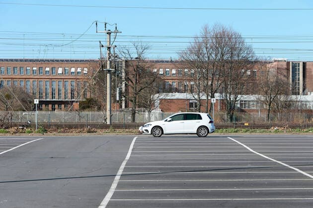 23 03 2020, xtgx, Effects of the Corona Virus in Wolfsburg, a single Golf is parked on the empty parking lot of the VW plant in Wolfsburg, Volkswagen has stopped production Wolfsburg