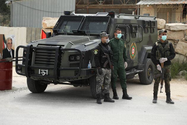 March 23, 2020: Nablus, Palestine. 23 March 2020. Members of the Palestinian National Security Forces carry out checks in the city of Nablus to enforce the implementation of new restrictive measures against the spread of the Coronavirus in the West Bank. On Sunday the Palestinian Prime Minister ordered a two-week ban on all non-essential movements to contain the spread of Covid-19, while the number of confirmed cases in the West Bank have risen to at least 57 - ZUMAd99_ 20200323_zap_d99_009 Copyright: xMohammedxTurabix