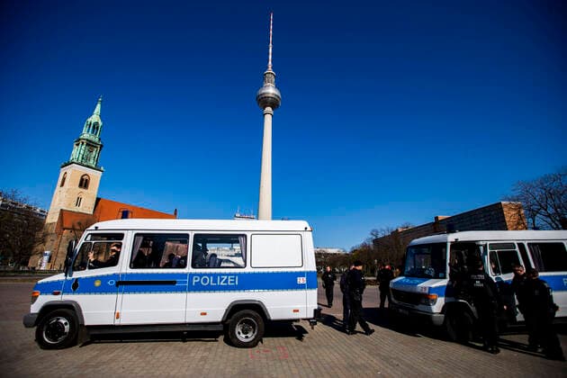 Police units and cars at Alexanderplatz in Berlin on 23 March 2020 To slow down the spread of the coronavirus COVID 19, the federal and state governments decided to impose further restrictions After museums, theatres, sports events etc. were banned, from today on meetings with more than two people in public are forbidden in principle Restaurants, for examp