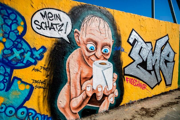 Graffiti showing the character of the Lord of the Rings Gollum with a roll of toilet paper and a speech bubble Mein Schatz am Mauerpark in Berlin on 23 March 2020 In order to slow down the spread of the coronavirus COVID 19, the federal and state governments d