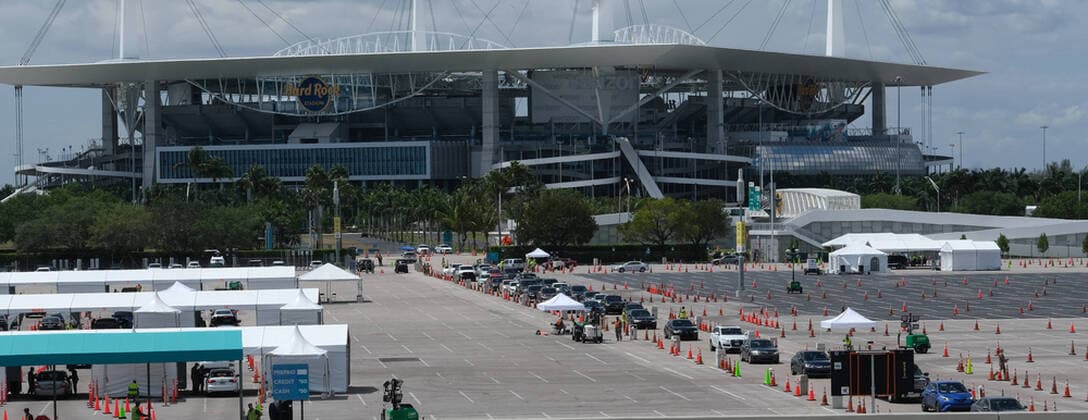 Miami Gardens residents arrive at the testing site to line up in the parking lot of the Hard Rock Stadium on the first day of Coronavirus testing on Monday, March 23, 2020 in Miami Gardens, Florida. This test site is scheduled to handle Miami Gardens area residents over the age of 65 from 7 A.M. to 5 P.M. daily to help identify residents with the Coronavirus.  MIA20200323101 GARYxIxROTHSTEIN
