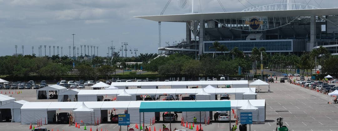 Miami Gardens residents arrive at the testing site to line up in the parking lot of the Hard Rock Stadium on the first day of Coronavirus testing on Monday, March 23, 2020 in Miami Gardens, Florida. This test site is scheduled to handle Miami Gardens area residents over the age of 65 from 7 A.M. to 5 P.M. daily to help identify residents with the Coronavirus.  MIA20200323102 GARYxIxROTHSTEIN