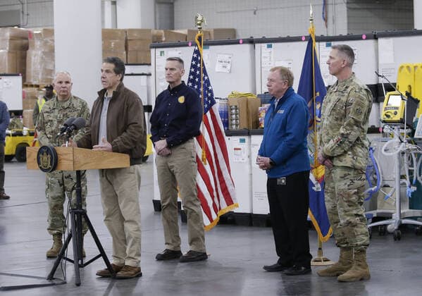 Gov. Andrew Cuomo speaks with the National Guard on site at the Jacob Javits Convention Center in New York City on Monday, March 23, 2020. The Javits Center is setting up to be turned into field hospitals to test and possibly treat cases of COVID-19 infections. New York state now accounts for about 1 percent of the coronavirus-related deaths in the world and New York City has more than 12,300 of those cases.  NYP20200323106 JOHNxANGELILLO