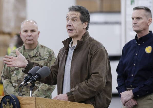 Gov. Andrew Cuomo speaks with the National Guard on site at the Jacob Javits Convention Center in New York City on Monday, March 23, 2020. The Javits Center is setting up to be turned into field hospitals to test and possibly treat cases of COVID-19 infections. New York state now accounts for about 1 percent of the coronavirus-related deaths in the world and New York City has more than 12,300 of those cases.  NYP20200323107 JOHNxANGELILLO