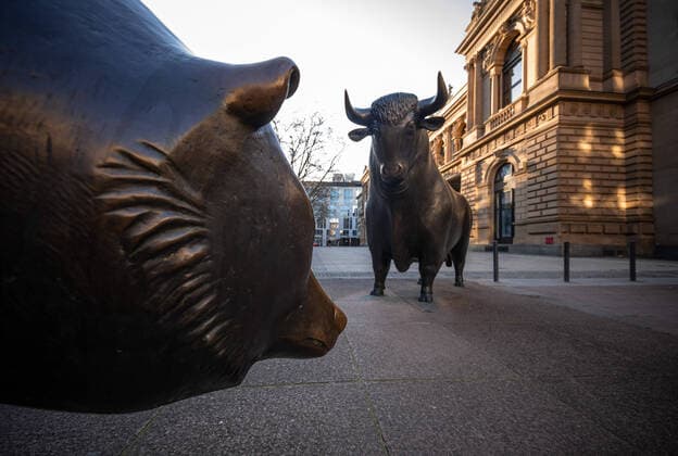 Bull and bear on the Frankfurt Stock Exchange at rush hour