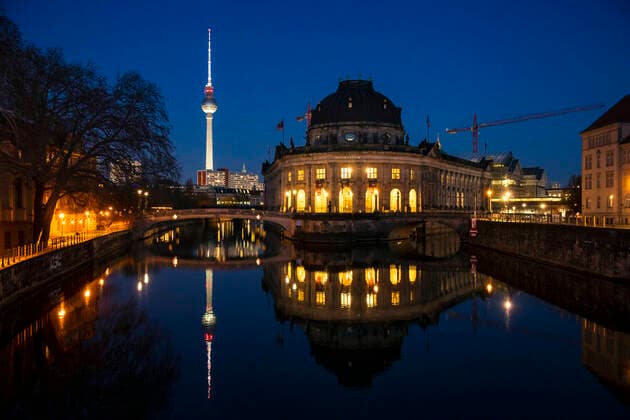 View of the Bode Museum with reflection on the river Spree during the blue hour in Berlin on 23 March 2020 In order to slow down the spread of the coronavirus COVID 19, the federal and state governments decided to impose further restrictions After museums, theatre