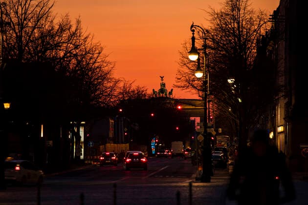 Empty Unter den Linden with a view of the Quadriga and Brandenburg Gate during the sunset in Berlin on 23 March 2020 To slow the spread of the corona virus COVID 19, the federal and state governments decided to impose further restrictions after