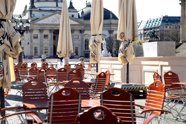 23 03 2020, Berlin Germany Corona crisis, Gendarmenmarkt, empty cafe, day 1 according to the new regulations for containing the coronavirus, people should only go out on the streets for the most necessary things