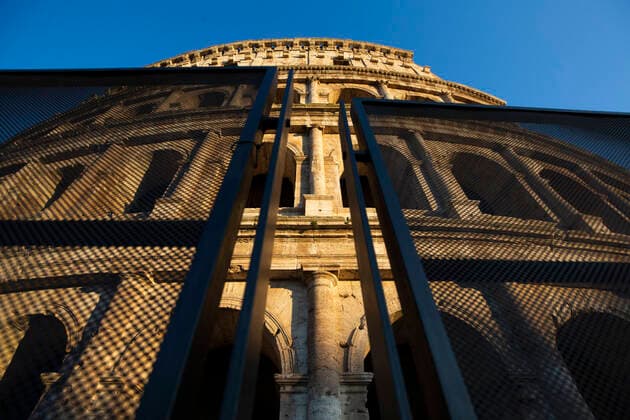 Italy: Rome sites during the Coronavirus outbreak A view of the Colosseum behind a barrier in Rome during the 14th day of lockdown imposed nationwide by the Italian government that tries to tackle the coronavirus outbreak. Every movements in the citiies are restricted, and streets usually filled with life and traffic are almost empty Roma Italy Italy Copyright: GiuseppexFama